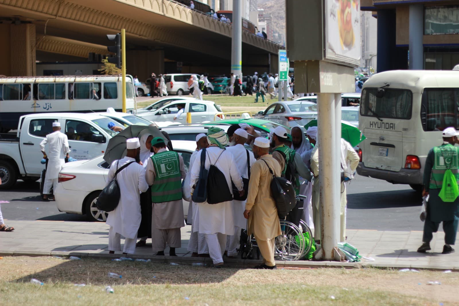 Group of volunteers helping pilgrims