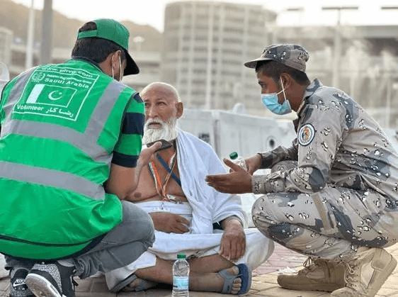 Volunteers helping pilgrims